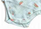 Detail shot of light blue cotton bodysuit with watermelon print, neat hem stitching, and three crotch snaps