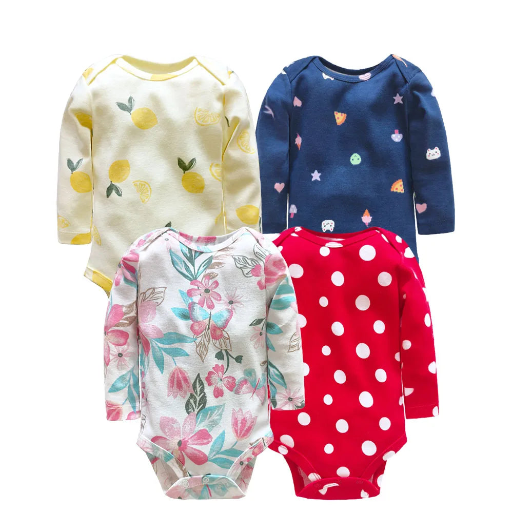 Four assorted long sleeve bodysuits together showing lemon, icon, floral, and polka dot prints