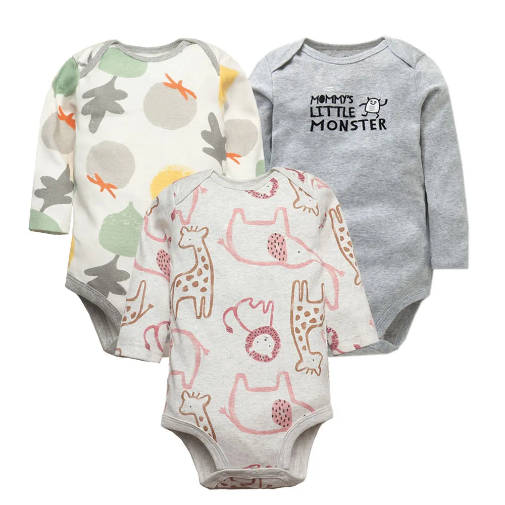 Collection of three nature-printed long sleeve bodysuits with trees, monsters, and giraffes on cream and grey bases