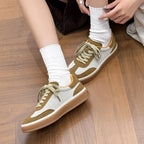 Close-up of model adjusting white sock above sneaker ankle, revealing interior lining and lace bow