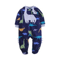 Navy blue romper with colorful dinosaur print, large white Brachiosaurus appliqué, and decorative leg spikes