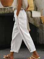 Hollow-Out Trimmed Cropped Pants with Drawstring and Pockets