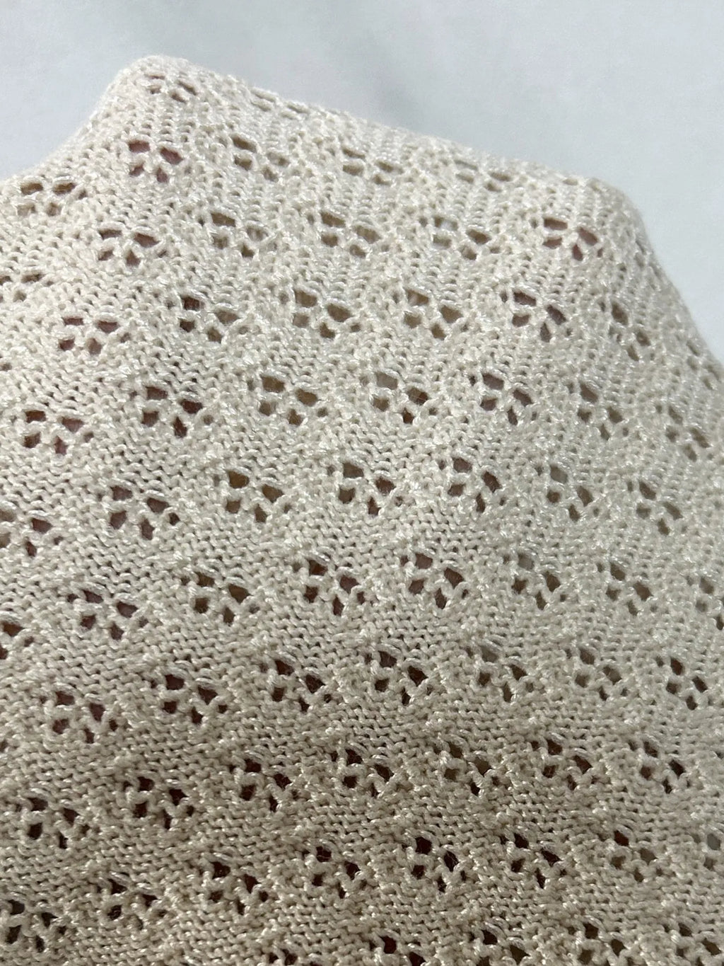 Women's Sweater Set Openwork Knit Button Up Short Sleeve Top and Mini Skirt a57a7f131d644a44afdd718fb2eca14b-Max-Origin Trendsi