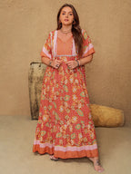 Plus Size Printed Maxi Dress with Tie Neck and Flutter Sleeves