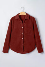 Rust-brown corduroy long sleeve shirt on hanger showing pointed collar and white buttons