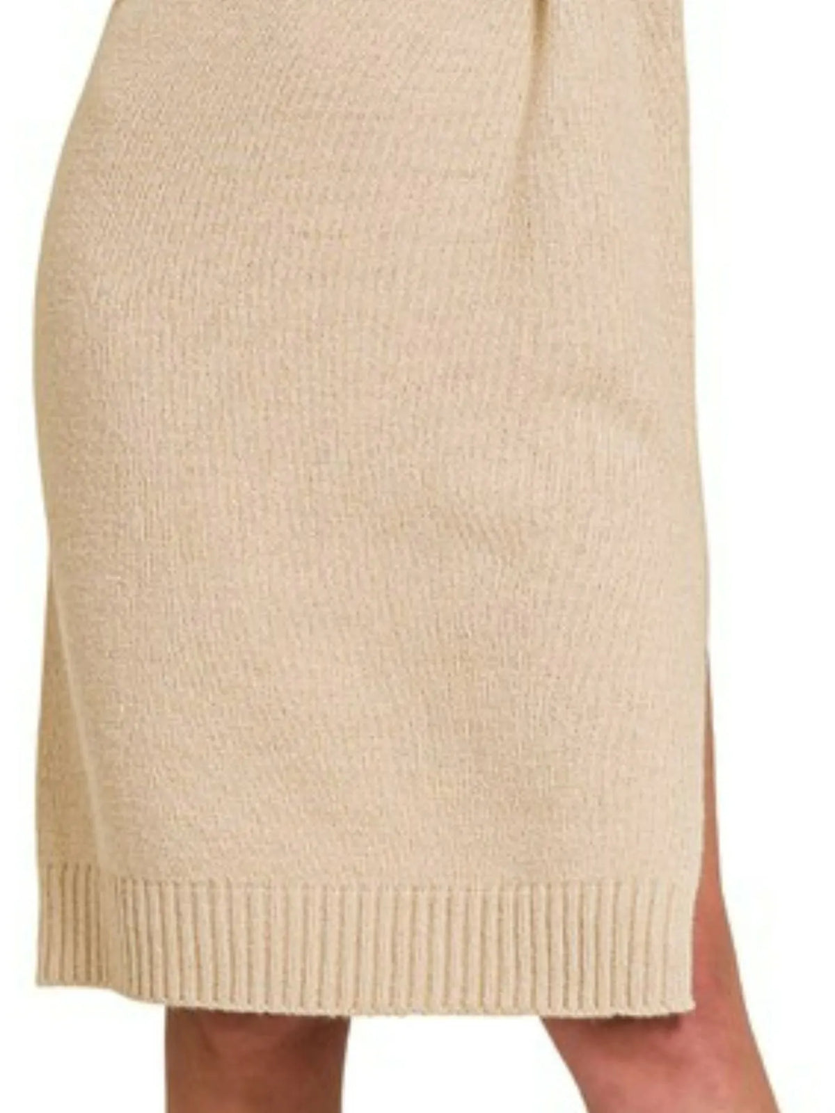 Lower body view of beige ribbed midi dress showing mid-calf hemline and side slit detail