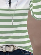 Green and white striped quarter zip tee with silver zipper and studded belt detail