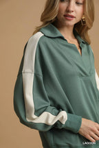 Close-up of soft cotton blend fabric texture, structured collar, and stitching details