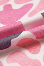 Folded fabric macro emphasizing soft heathered polyester and vibrant pink grey white contrast