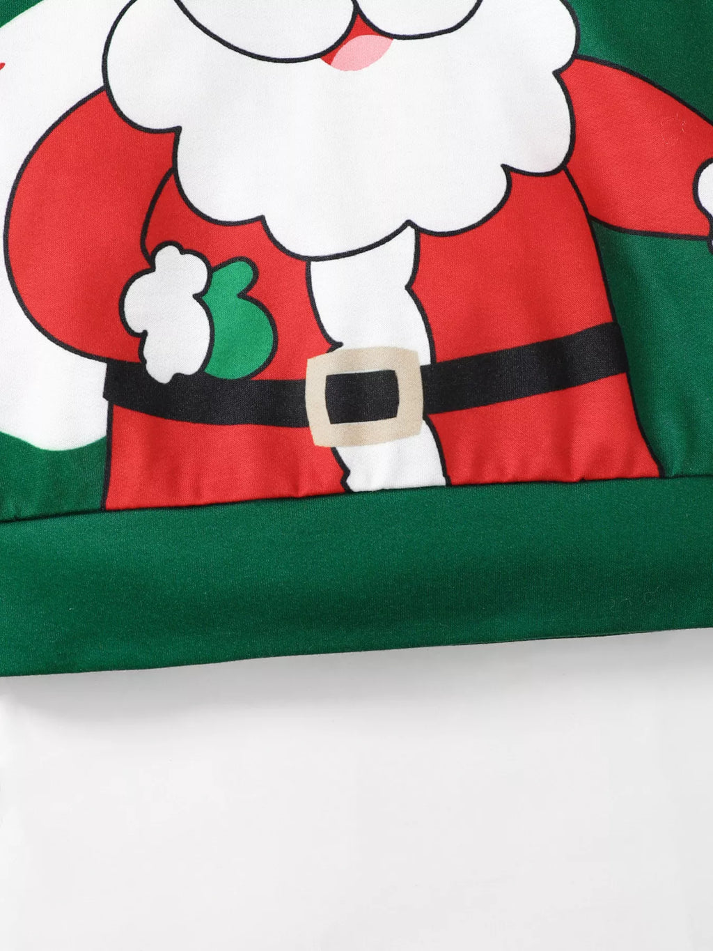 Detailed crop of lower Santa graphic on green sweatshirt showing red suit fabric black belt beige buckle and ribbed green hem