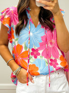 Sleeveless Blouse with Floral Print, Tie Neck, V-Neckline, and Ruffle Trim