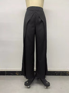 Front view of black high-waisted pants with draped V-shape overlap panel detail