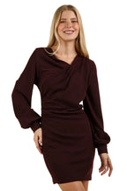 Front portrait of asymmetrical wrap-style chest detail on stretchy burgundy party dress