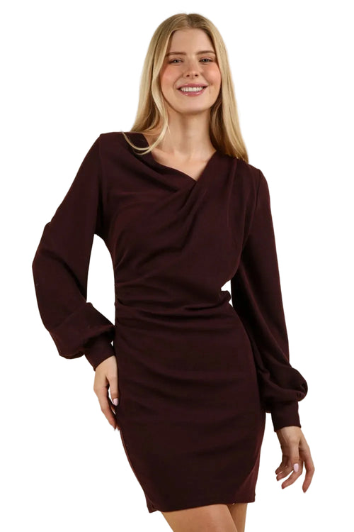 Front portrait of asymmetrical wrap-style chest detail on stretchy burgundy party dress