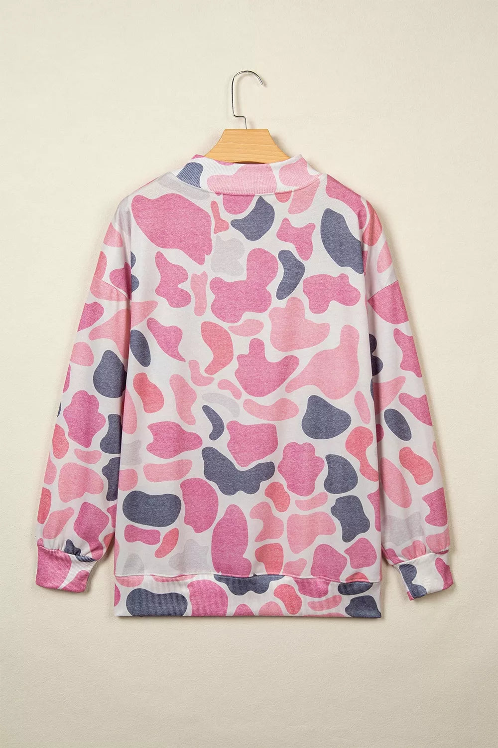 Back view of all-over pink and grey abstract camo patterned sweatshirt without graphics