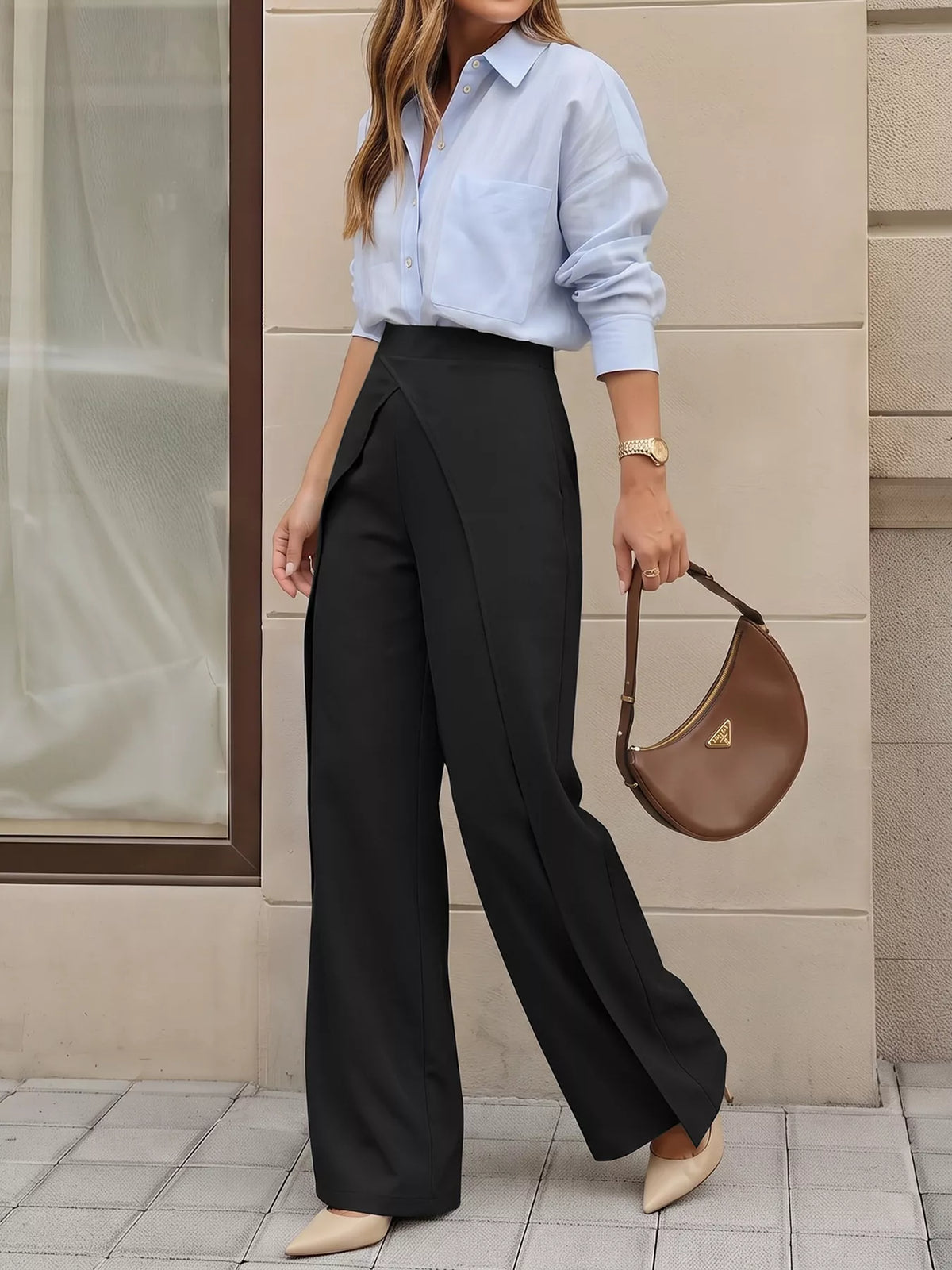 Side profile of black flowy silhouette pants showing elastic waistband while walking
