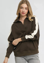 Espresso brown oversized polo sweatshirt with wide cream stripes on sleeves and V-neck placket