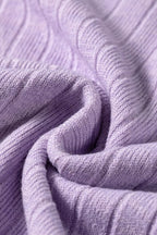Swirling folds of light purple ribbed sweater fabric showcasing elasticity and plush synthetic blend