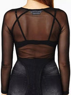 Back view of black mesh top showing racerback design with thin straps crossing upper back