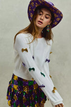 SO ME Sweater Knit Top Mardi Gras Glitter Bow Ribbon Ivory f794cbd284e74715a576becdb85a10e2-Max-Origin Trendsi